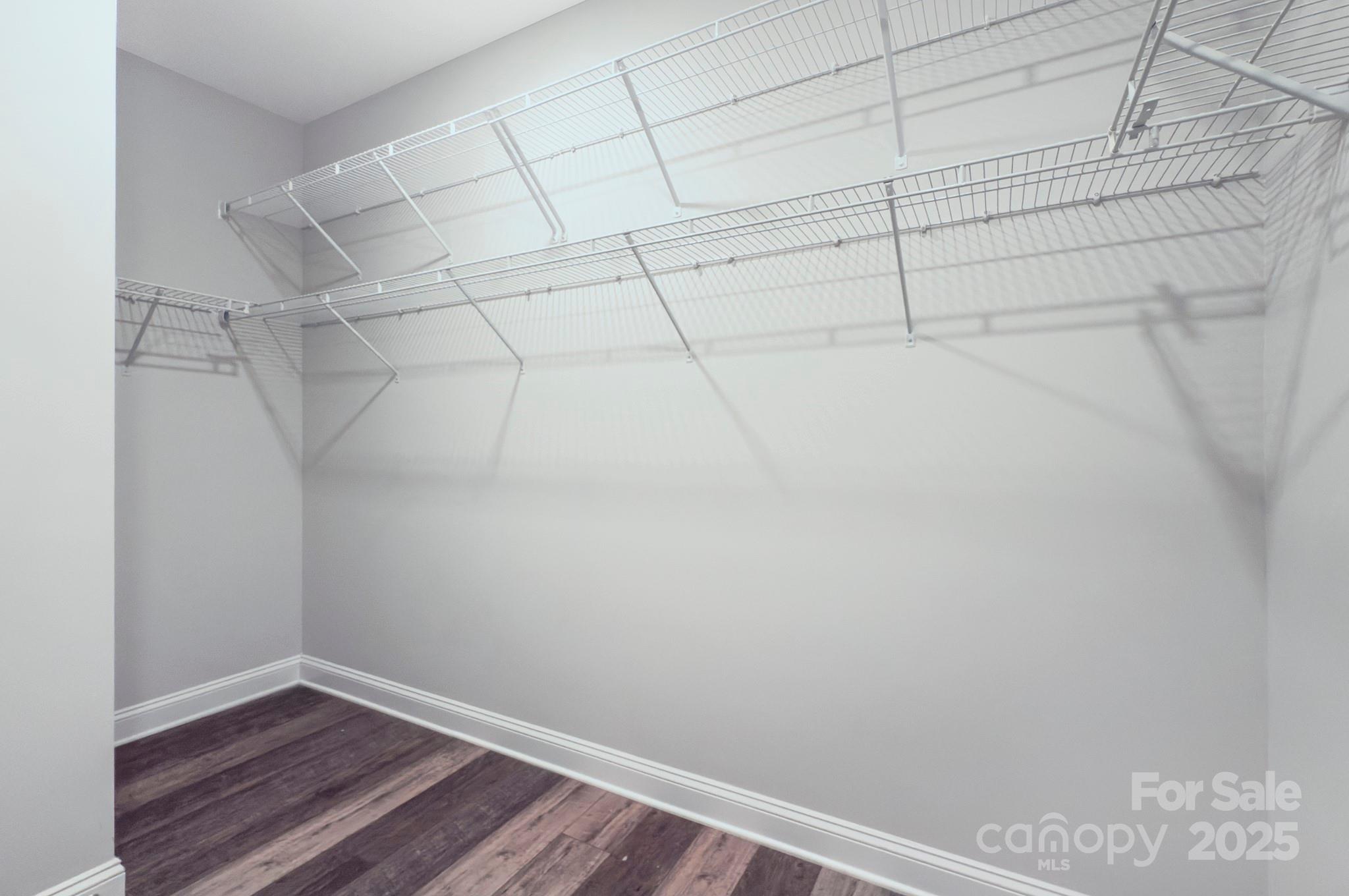 5527 Cheerful Lane Charlotte, NC 28215 - Photo 21 of 46 a view of a room with racks on the wall
