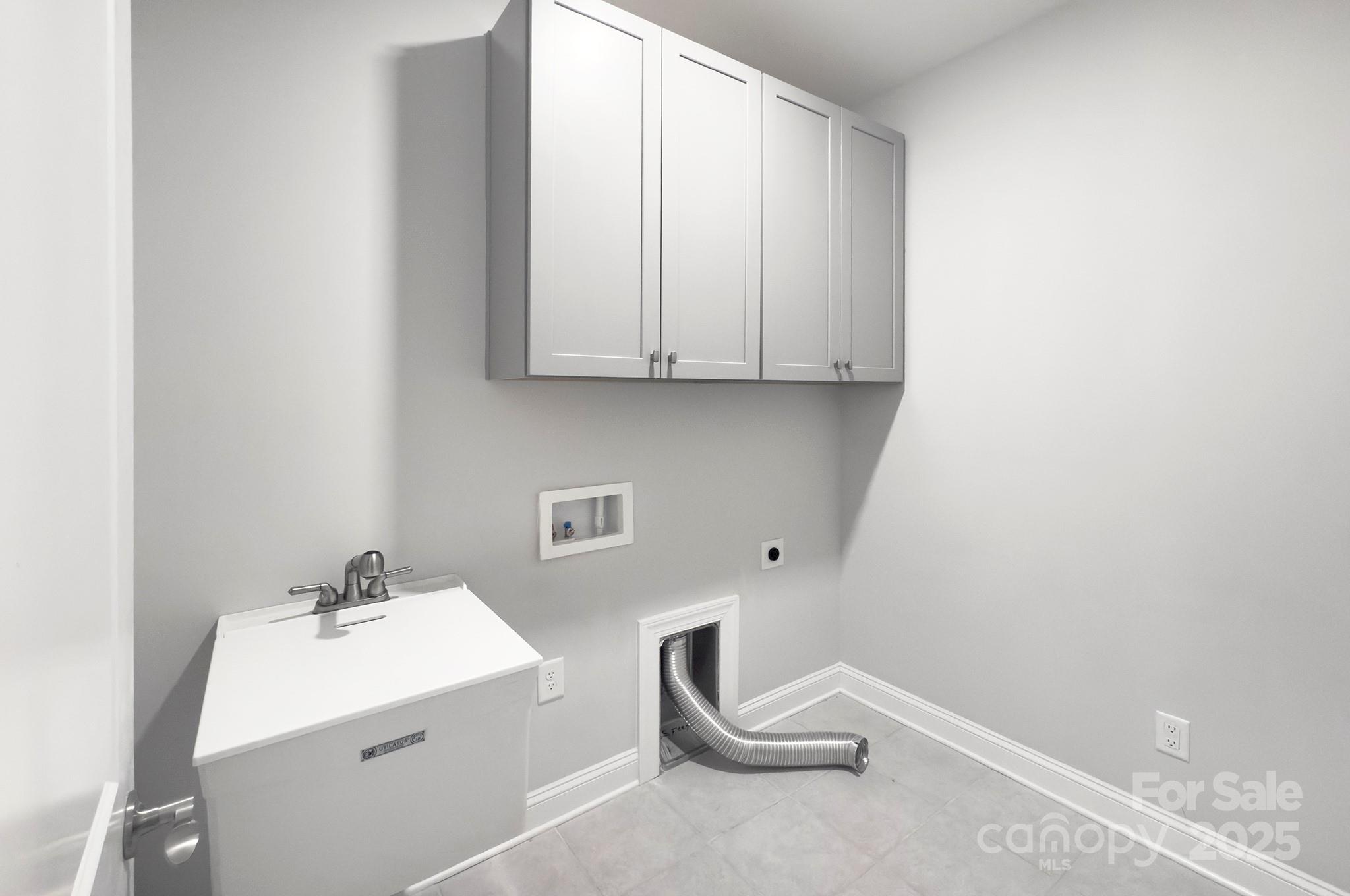 5527 Cheerful Lane Charlotte, NC 28215 - Photo 30 of 46 a utility room with dryer and washer