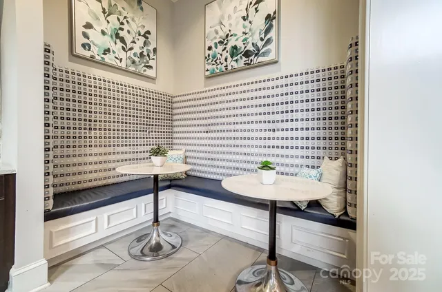 a table with a vase and flowers on it