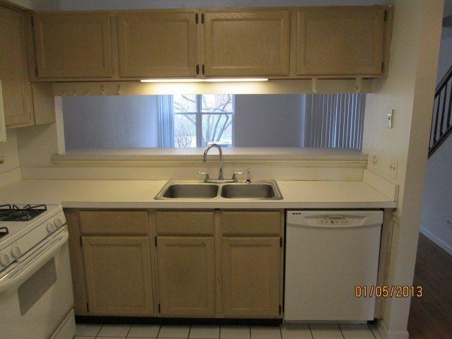 1074 Stillwater Road Elgin, IL 60120 - Photo 3 of 11 a sink with cabinets