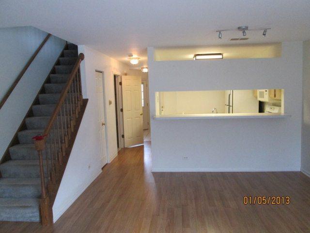 1074 Stillwater Road Elgin, IL 60120 - Photo 6 of 11 a view of a hallway with wooden floor