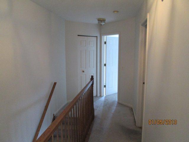 1074 Stillwater Road Elgin, IL 60120 - Photo 7 of 11 a view of a hallway with wooden floor