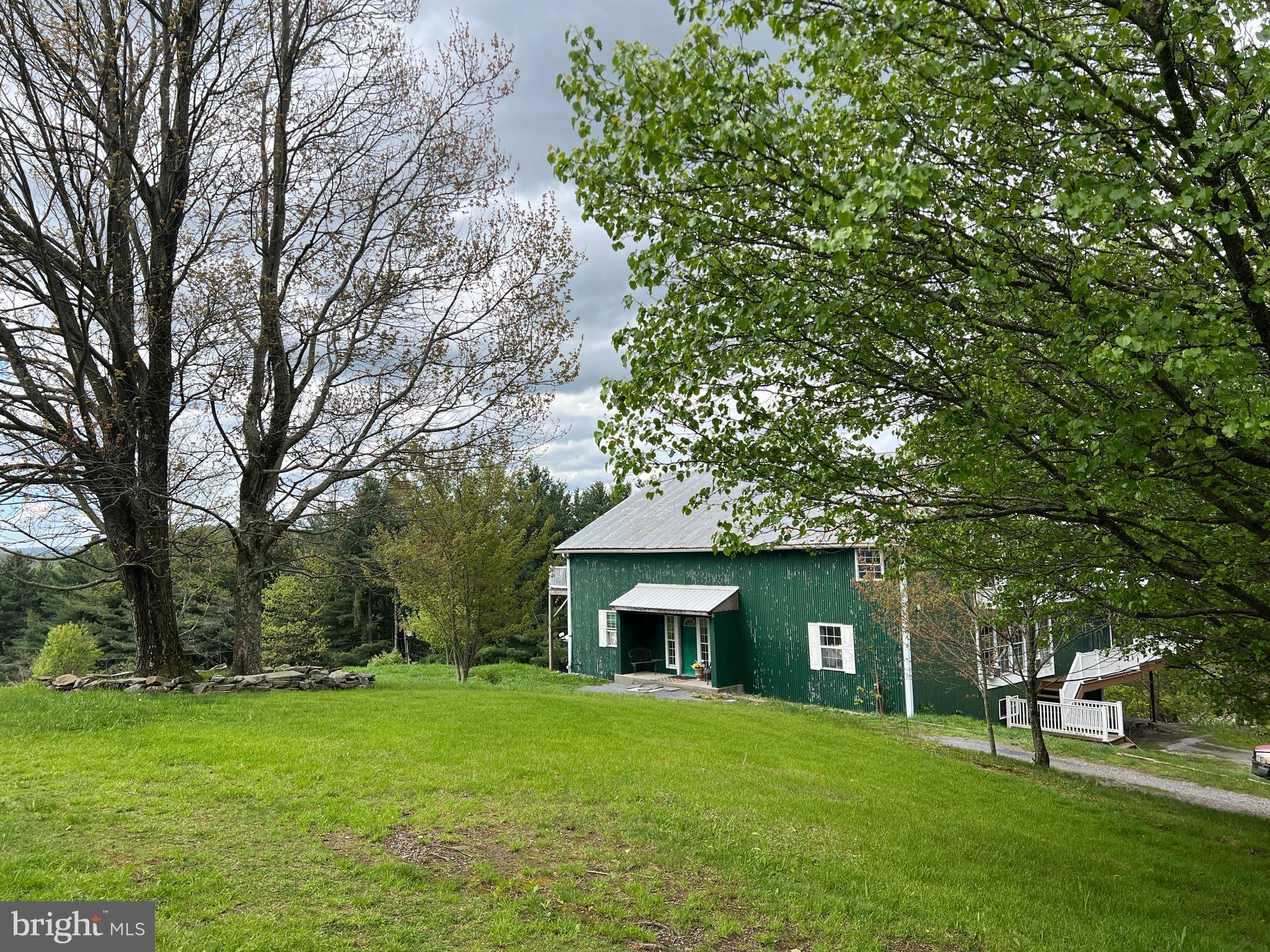 2221 Dry Run Road Swanton, MD 21561 - Photo 1 of 1 a front view of a house with a garden