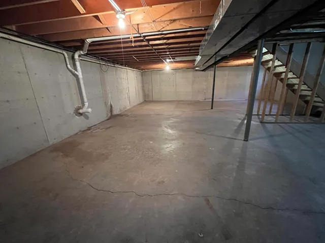 a view of empty room with wooden walls