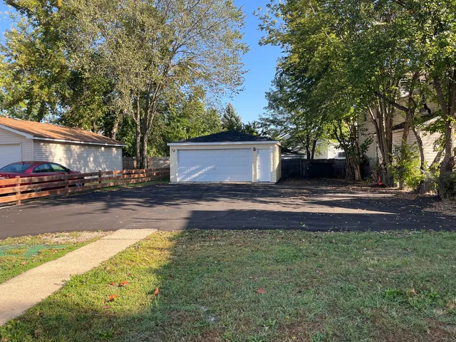a view of street with large trees
