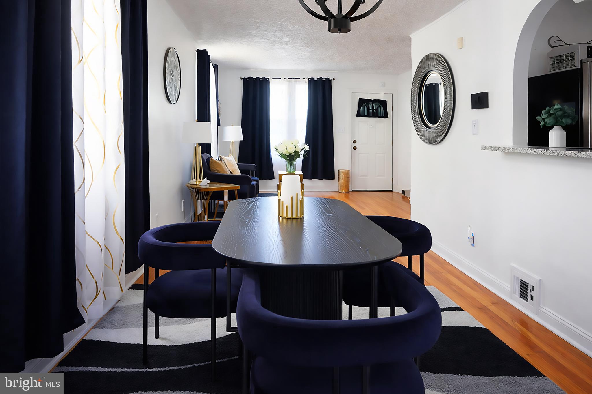 3935 Clay Place Northeast Washington, DC 20019 - Photo 3 of 17 a view of a dining room with furniture and wooden floor