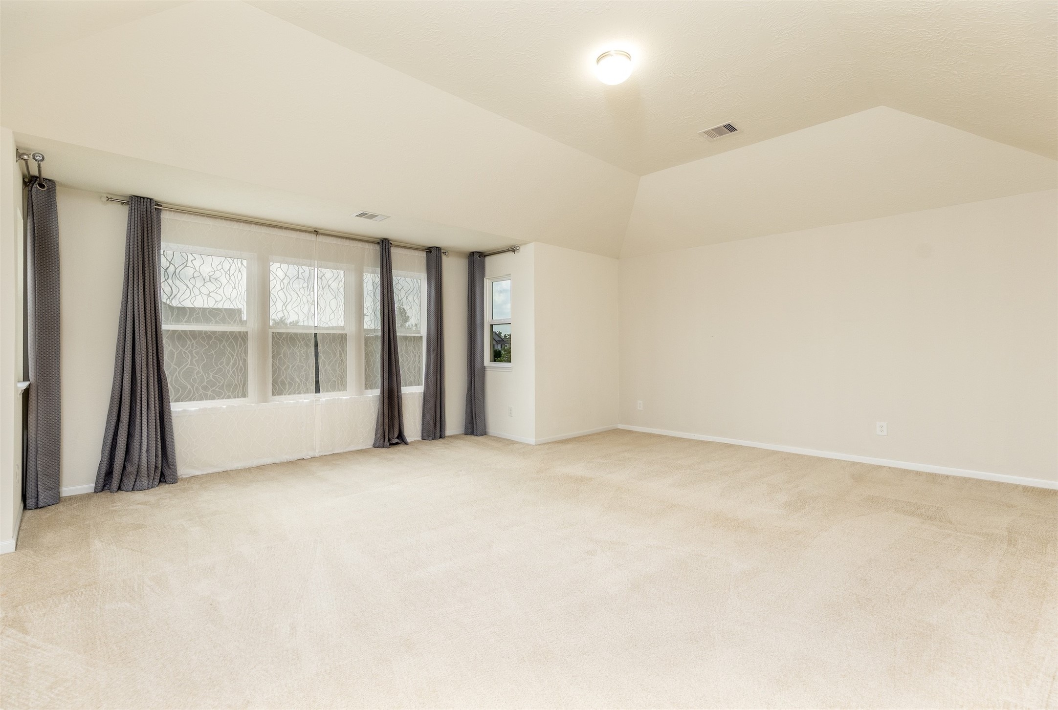 15623 Hanover Breeze Lane Houston, TX 77044 - Photo 14 of 46 a view of an empty room with a window