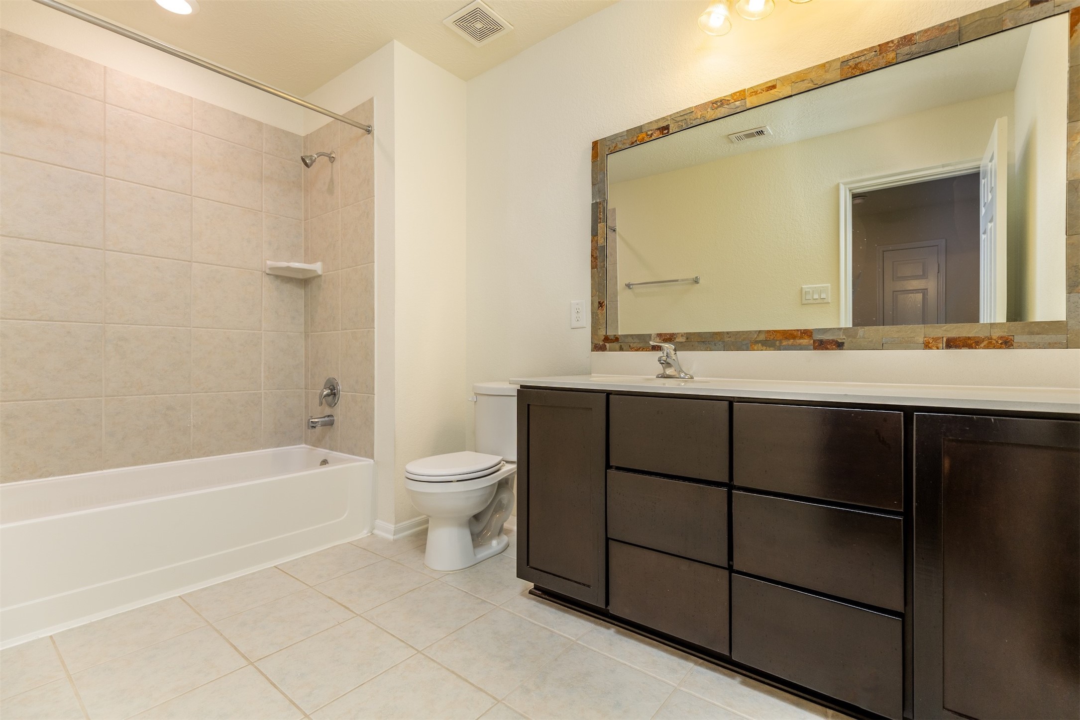 15623 Hanover Breeze Lane Houston, TX 77044 - Photo 25 of 46 a bathroom with a sink toilet and shower