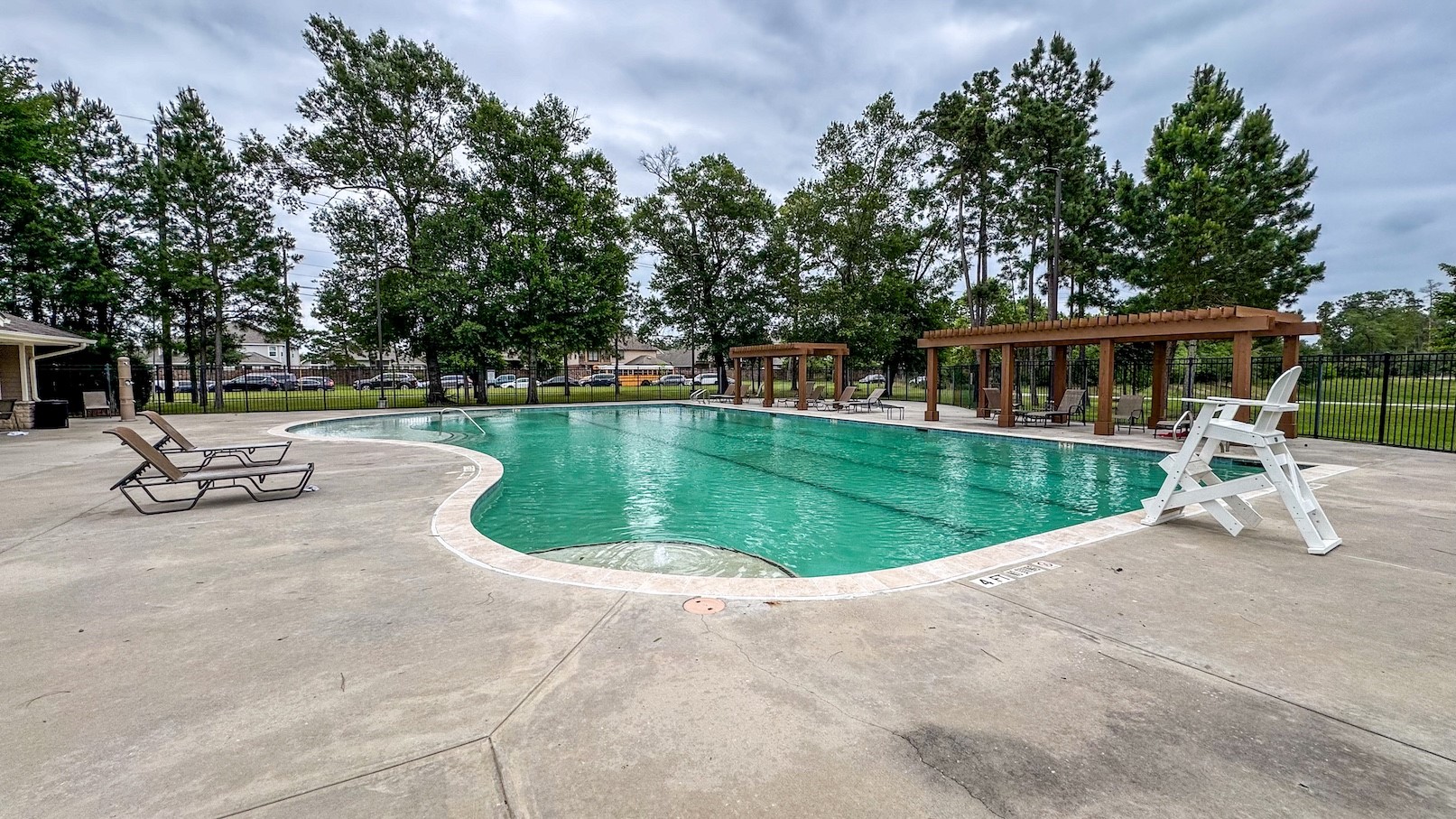 15623 Hanover Breeze Lane Houston, TX 77044 - Photo 42 of 46 a swimming pool with outdoor seating and yard