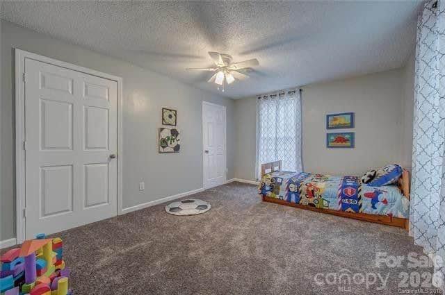 116 7th Street Cramerton, NC 28032 - Photo 7 of 9 a living room with baby toys