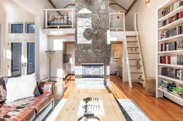 a living room with hard wood floors and a couch