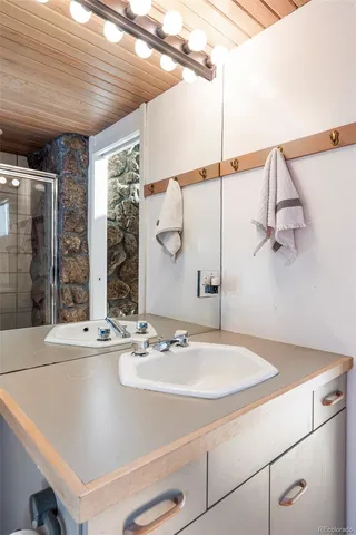 a bathroom with a sink and a mirror