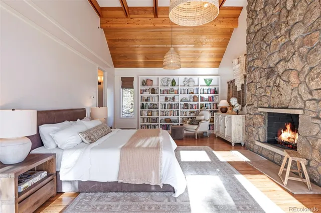 a living room with a couch and a fireplace