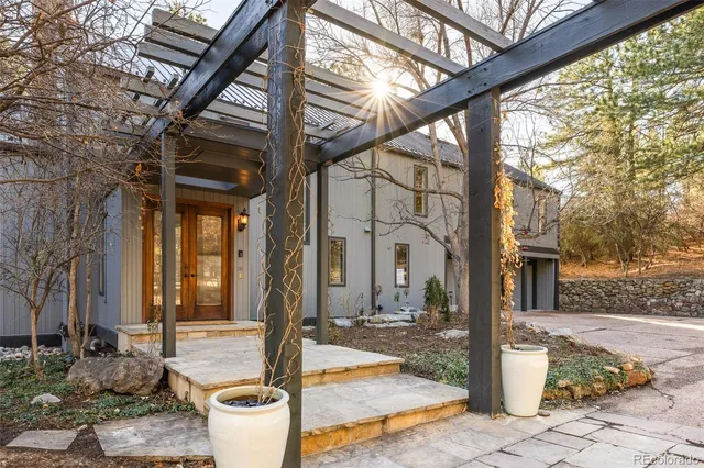 a view of a patio with table and chairs and potted plants