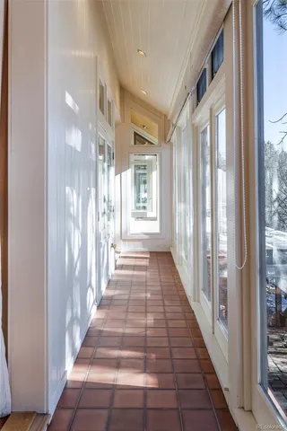 a view of a hallway with windows