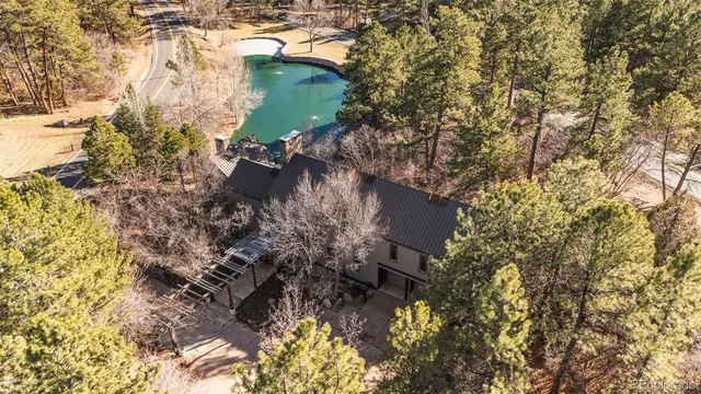 a aerial view of a house with a yard