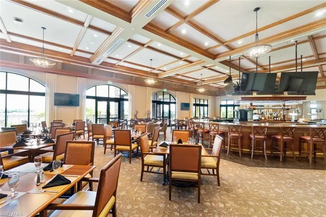 a living room with lots of furniture and a chandelier