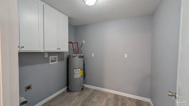 a view of storage and utility room with closet