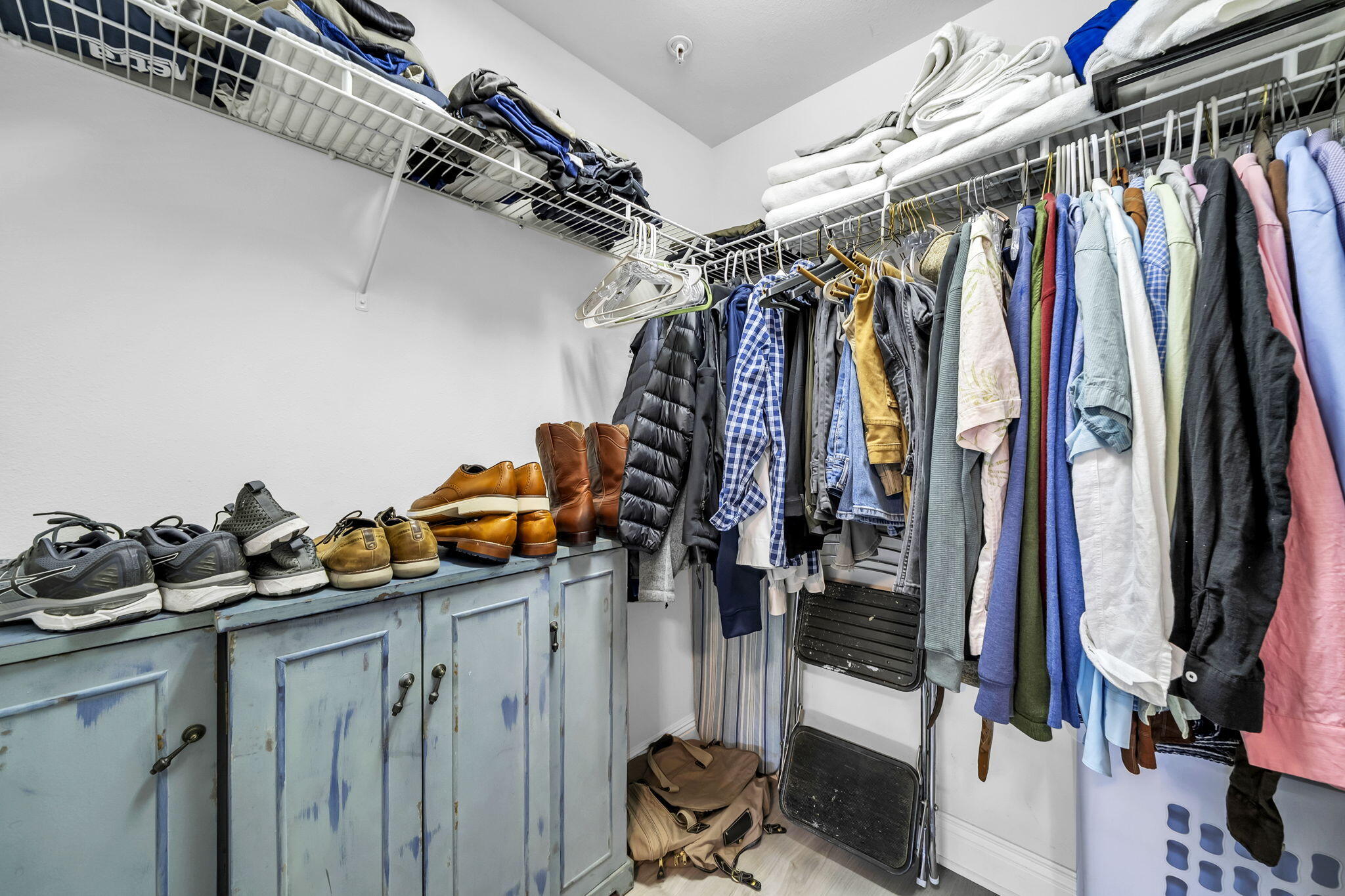 117 Village Boulevard, Unit 711 Santa Rosa Beach, FL 32459 - Photo 25 of 47 a view of walk in closet with clothes and shoes