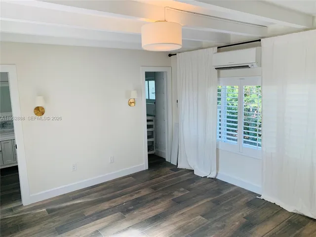 a bathroom with a sink a mirror and a bathtub