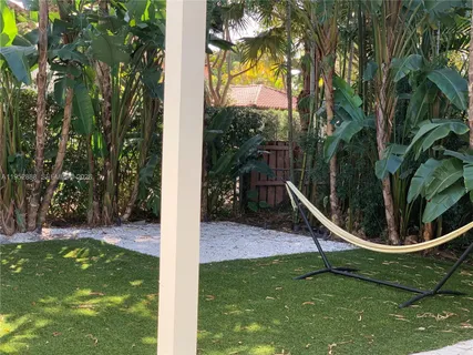a view of a slide in a backyard
