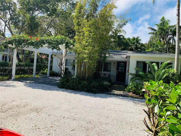 a view of house with outdoor space and garden