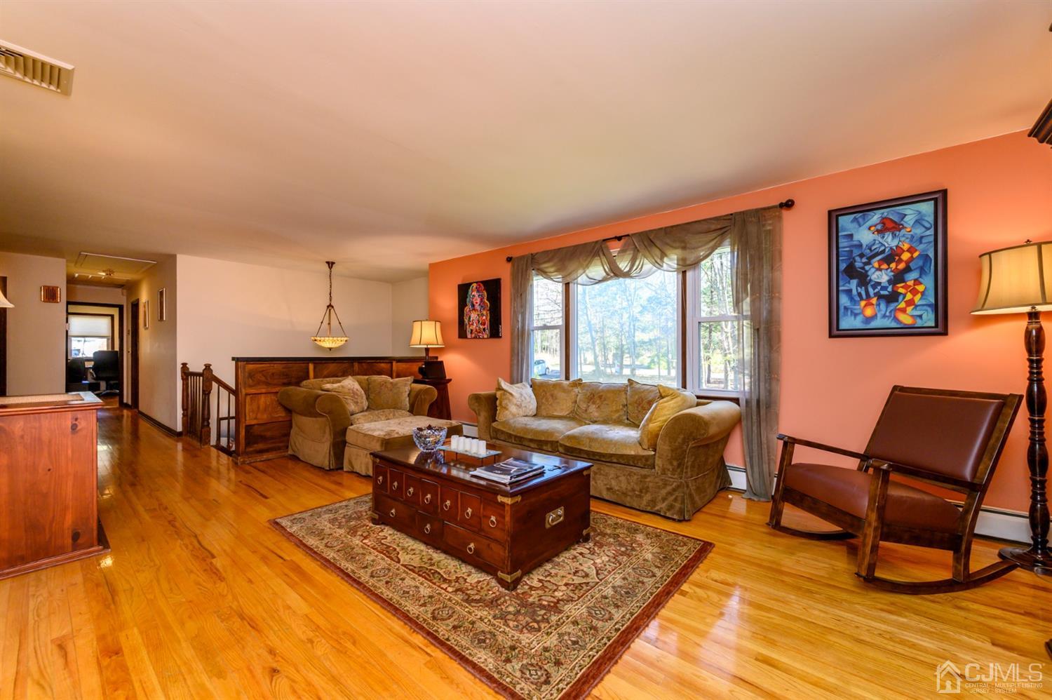 56 Valley View Road Warren, NJ 07059 - Photo 3 of 40 a living room with furniture and a rug