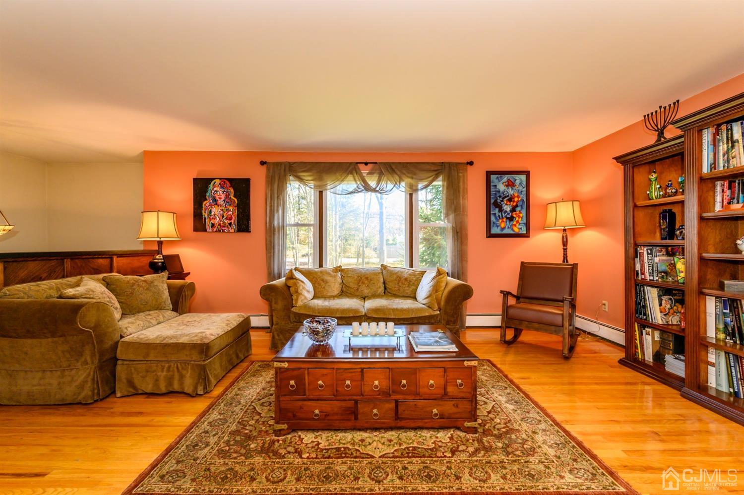 56 Valley View Road Warren, NJ 07059 - Photo 4 of 40 a living room with furniture a large window and a rug