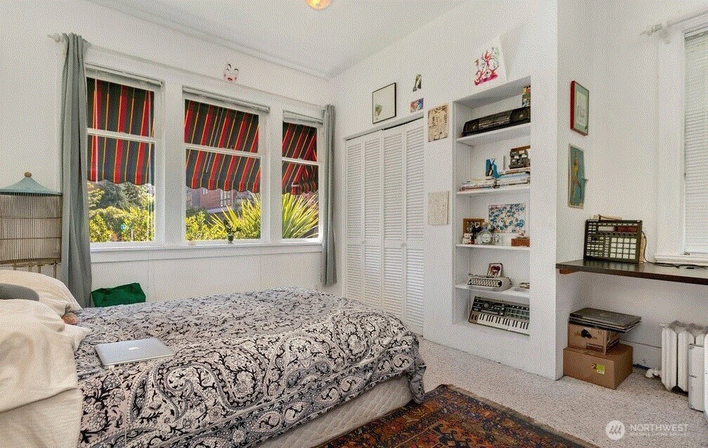 1745 12th Avenue South, Unit 1 4 Seattle, WA 98144 - Photo 15 of 39 a bedroom with a bed and a window