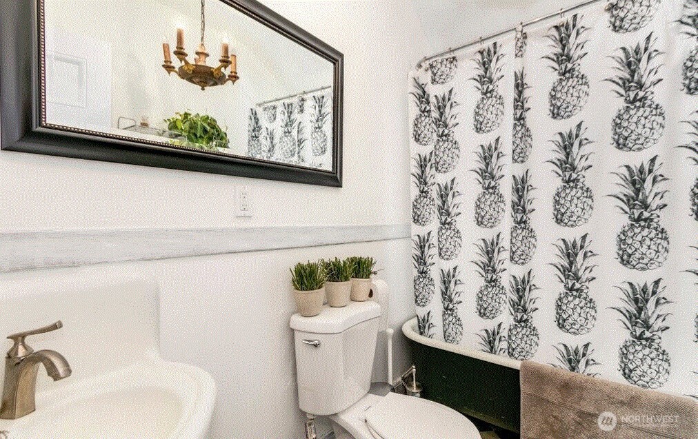 1745 12th Avenue South, Unit 1 4 Seattle, WA 98144 - Photo 27 of 39 a white toilet sitting next to a bathroom sink