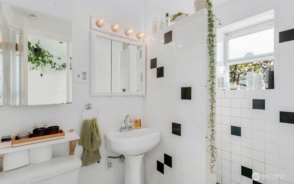 1745 12th Avenue South, Unit 1 4 Seattle, WA 98144 - Photo 8 of 39 a bathroom with a sink a toilet and shower