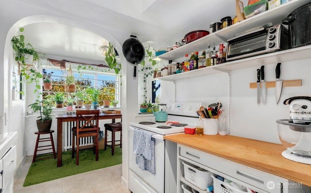 1745 12th Avenue South, Unit 1 4 Seattle, WA 98144 - Photo 9 of 39 a kitchen with a table and chairs in it