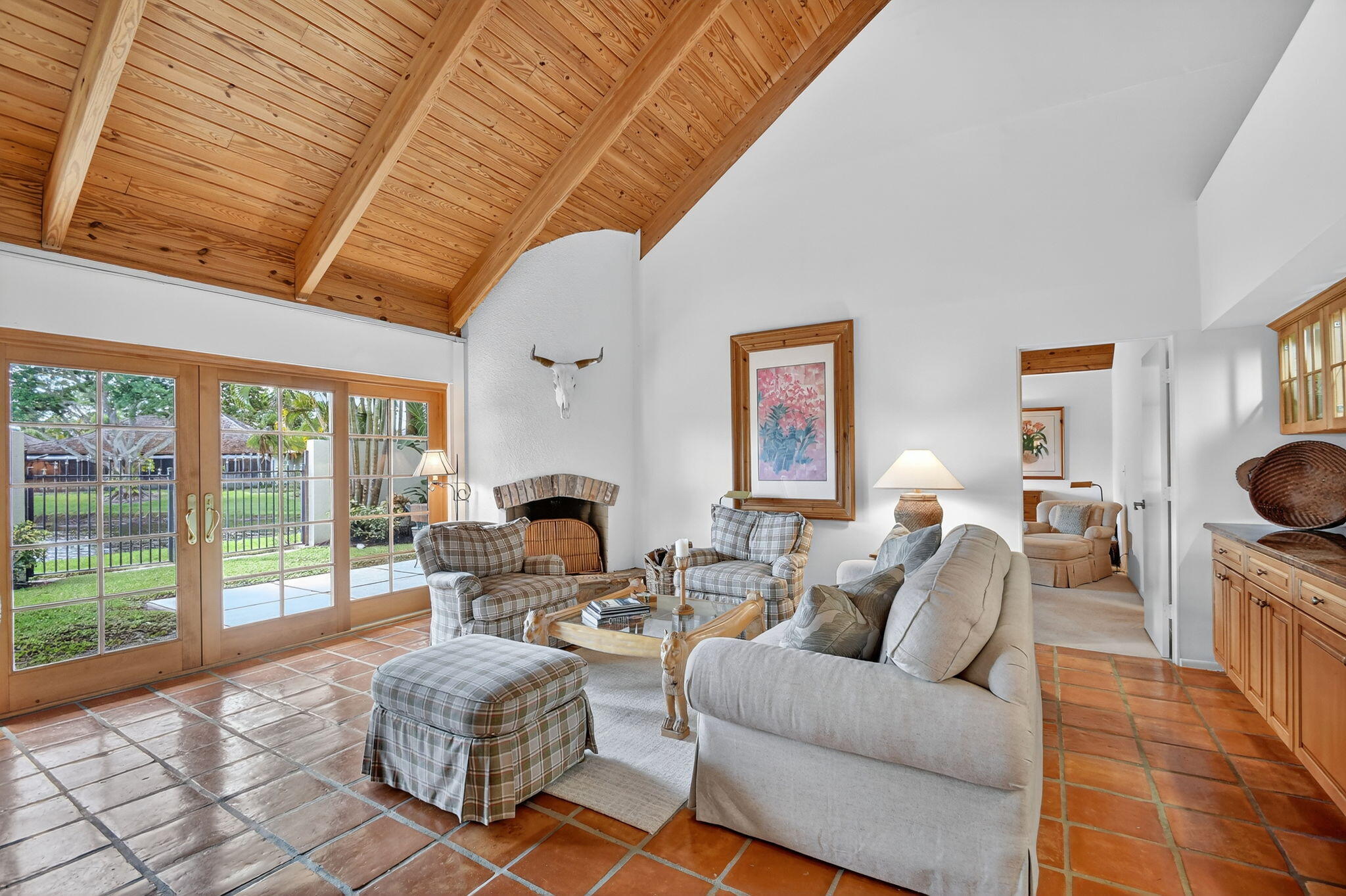 11854 Rene Lacoste Place Wellington, FL 33414 - Photo 8 of 45 a living room with furniture a fireplace and a table