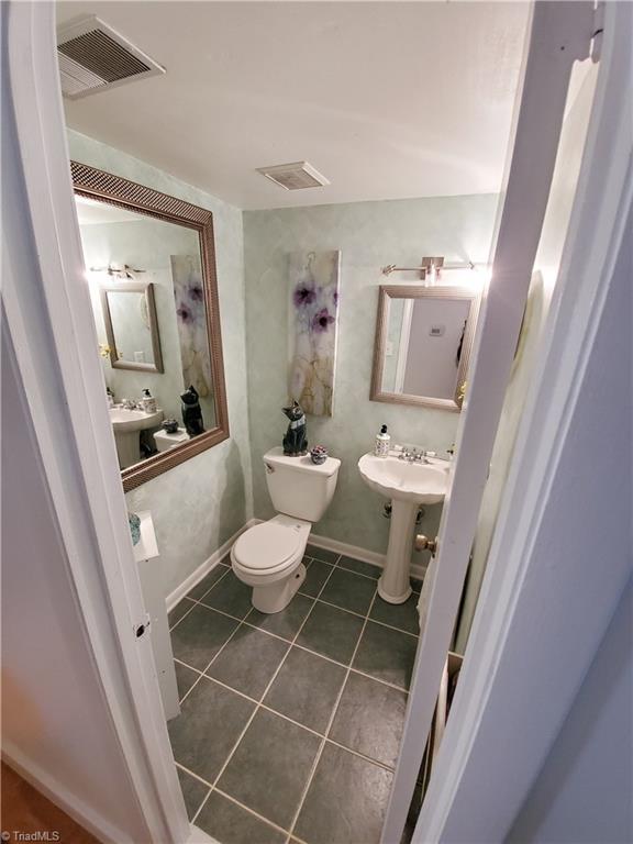 5711 Bramblegate Road, Unit M Greensboro, NC 27409 - Photo 5 of 15 Downstairs Powder room