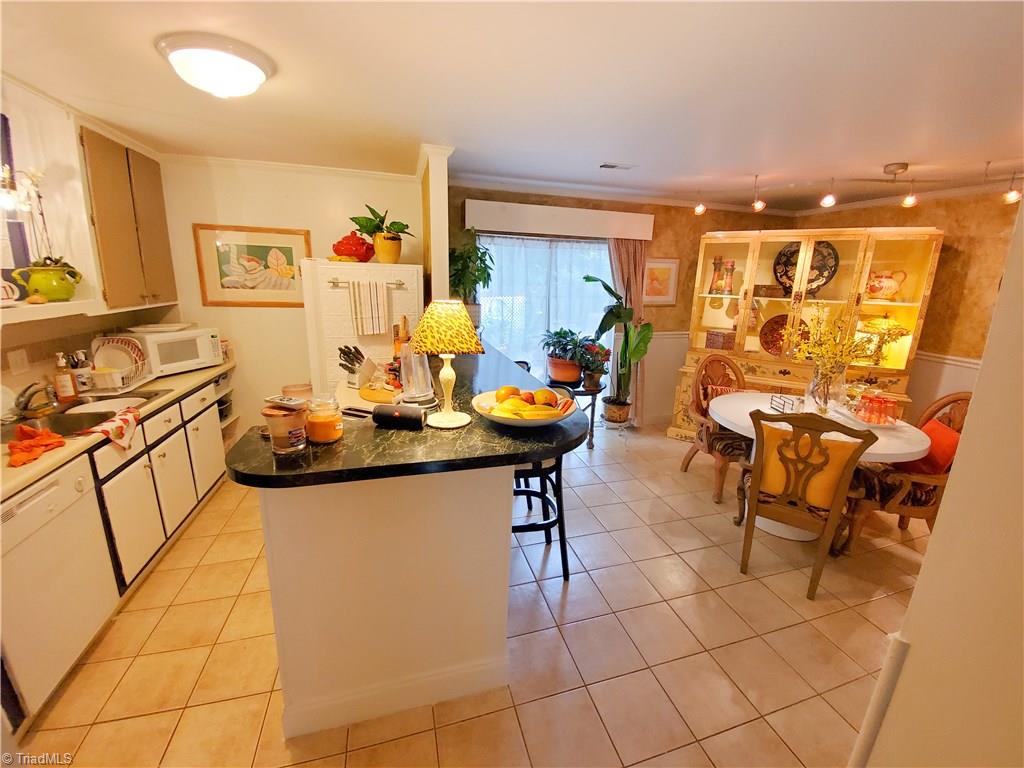 5711 Bramblegate Road, Unit M Greensboro, NC 27409 - Photo 6 of 15 Kitchen and Dinning Room
