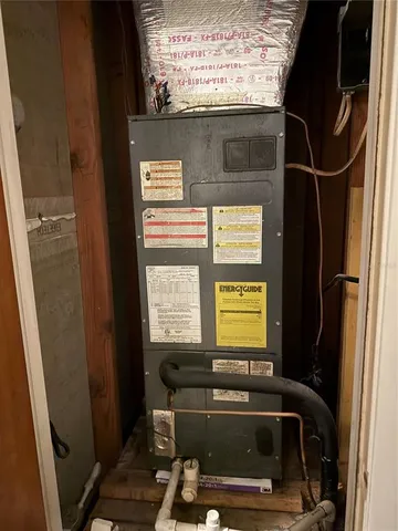 a bathroom with a sink a toilet and a window