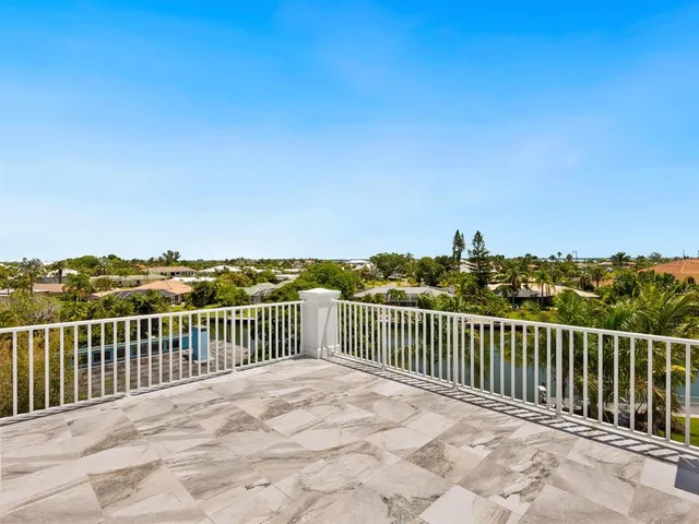 a view of a roof with wooden fence