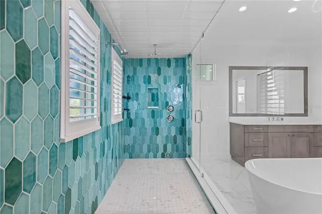 a bathroom with a bathtub and shower