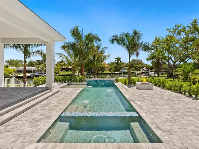 a view of swimming pool with a lounge chair