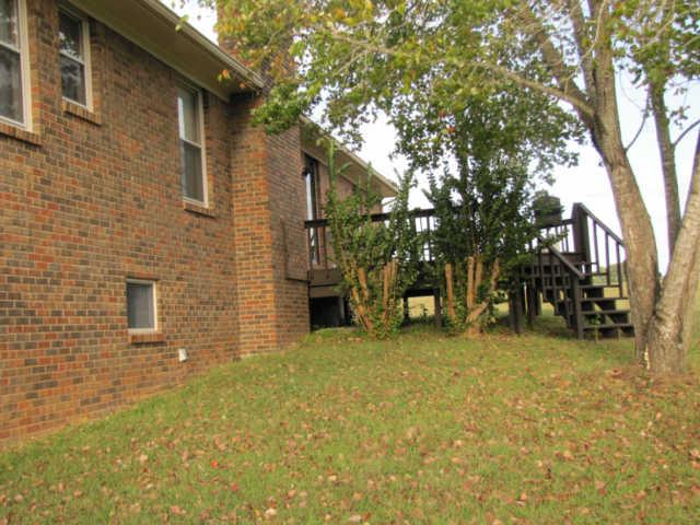 249 Lincoln Road Fayetteville, TN 37334 - Photo 3 of 13 BACK OF HOME HAS LARGE DECK AND LEADS OUT TO THE WORKSHOP AND THE 40X60 BARN