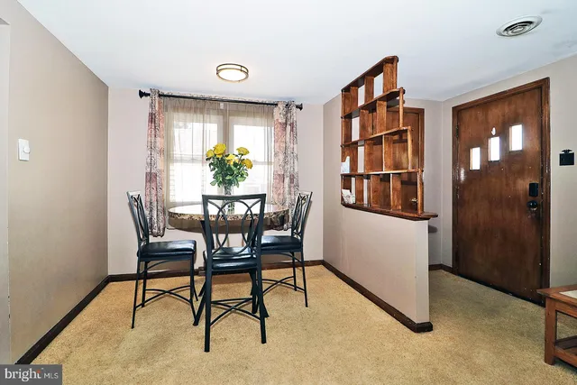 a view of a livingroom with furniture and a window