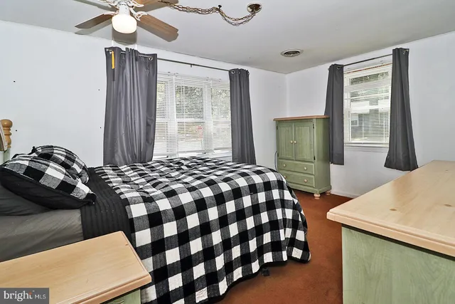 a bedroom with a bed and a table