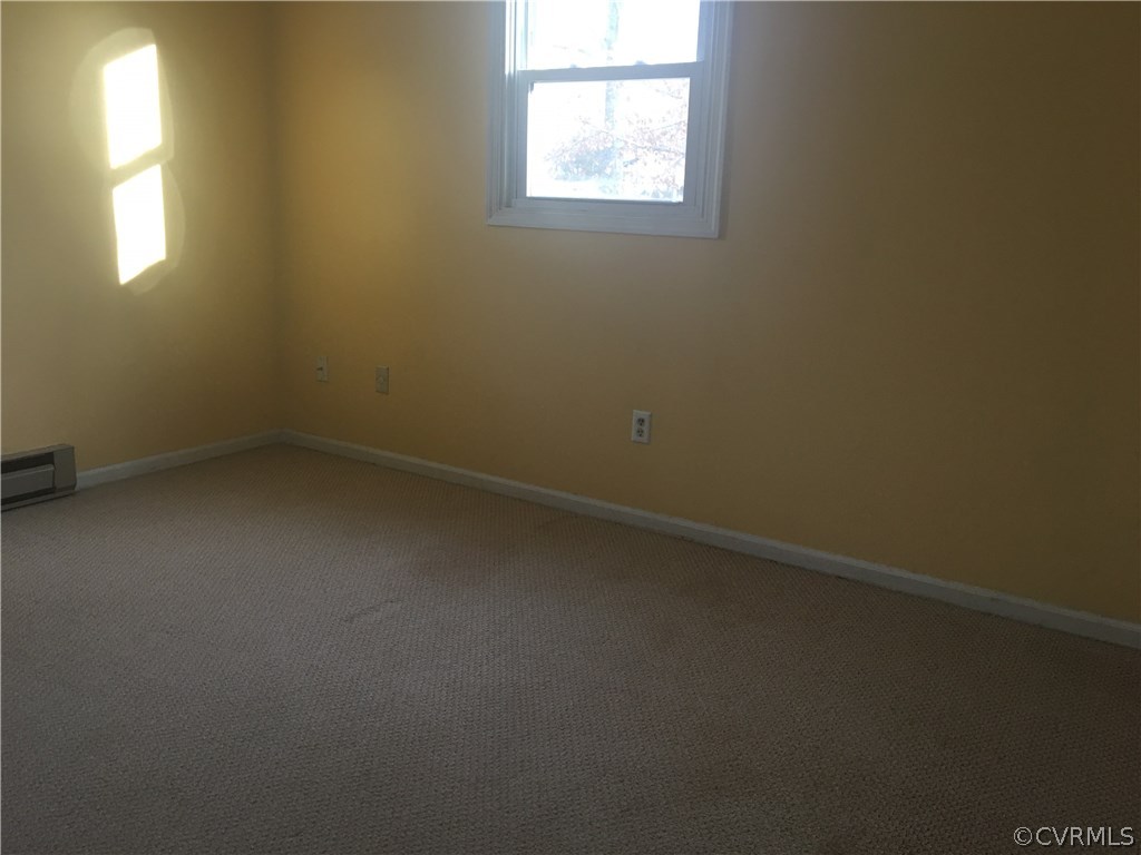 5253 Rollingway Road Chesterfield, VA 23832 - Photo 11 of 16 an empty room with a window