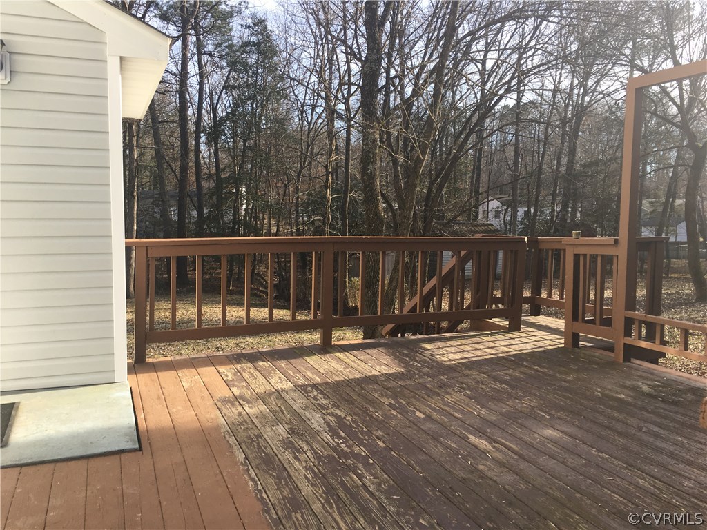 5253 Rollingway Road Chesterfield, VA 23832 - Photo 16 of 16 a view of a balcony with wooden floor and fence