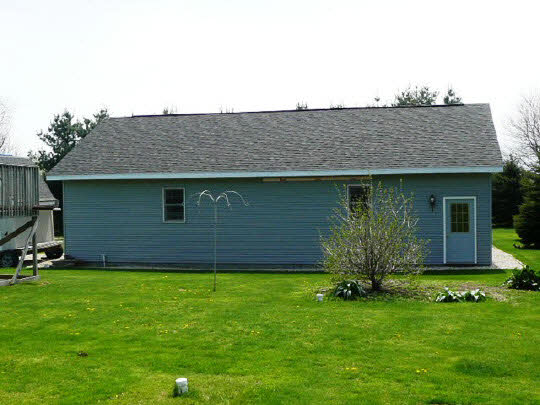 1965 East Water Road Byron, IL 61010 - Photo 3 of 11 a view of a house with a yard