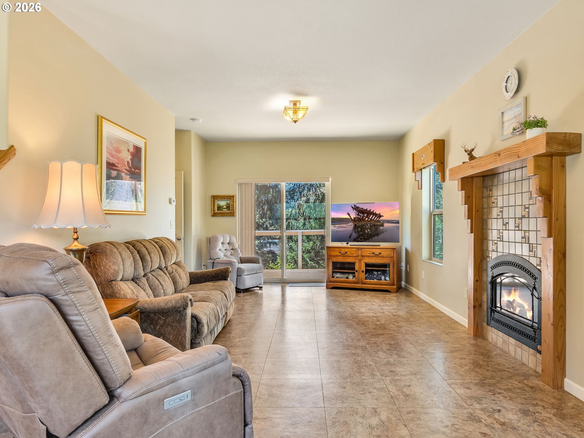 1077 Southwest Ridge Road Warrenton, OR 97146 - Photo 9 of 46 a living room with furniture and a flat screen tv