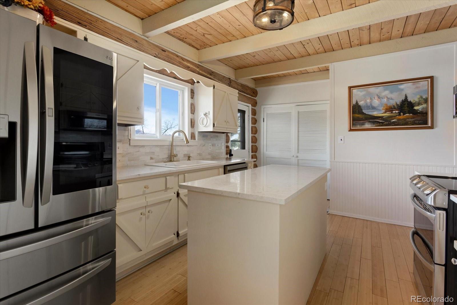 716 West Blarney Stone Road Howard, CO 81233 - Photo 11 of 50 a kitchen with a sink appliances and cabinets