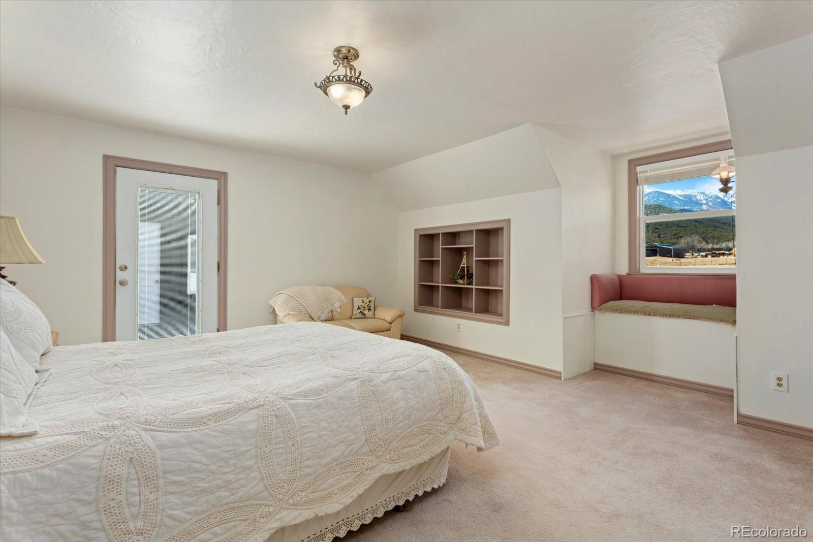 716 West Blarney Stone Road Howard, CO 81233 - Photo 27 of 50 a bedroom with a bed and a window