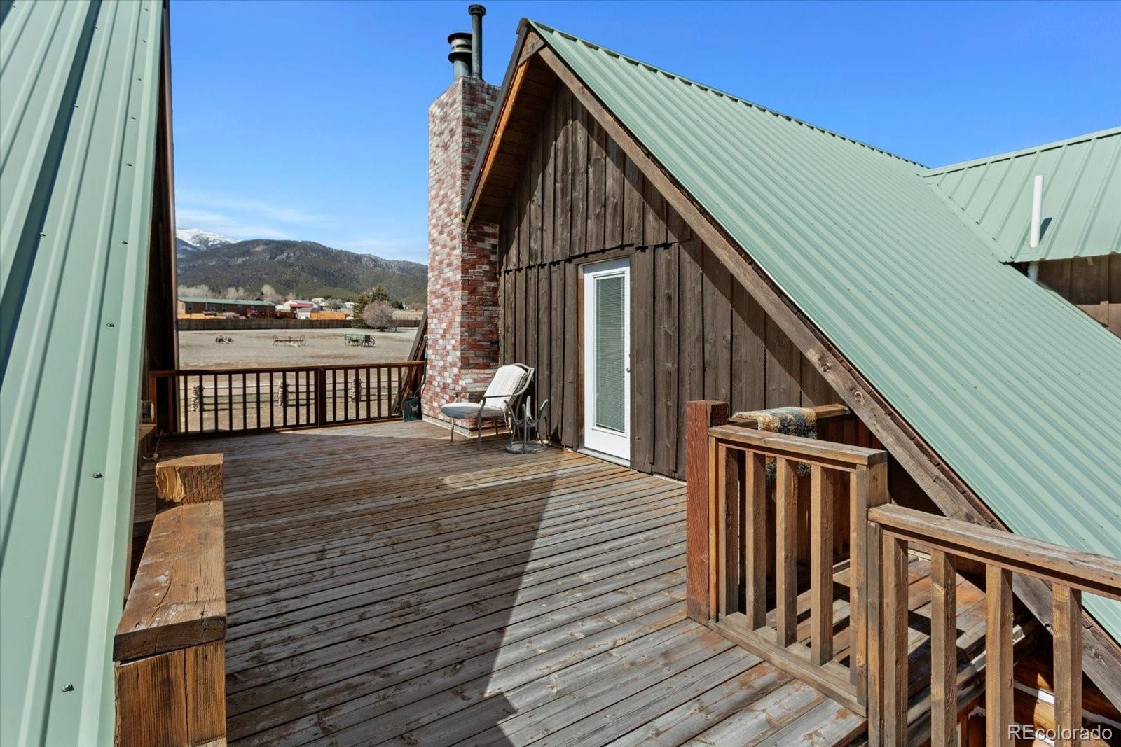 716 West Blarney Stone Road Howard, CO 81233 - Photo 30 of 50 a view of balcony with wooden floor and fence