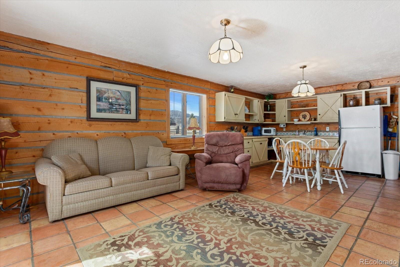 716 West Blarney Stone Road Howard, CO 81233 - Photo 32 of 50 a living room with furniture and a dining table